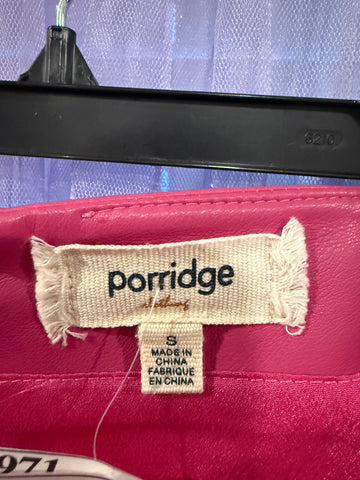 Porridge brand label with frayed edges and size 8 label inside pink skirt