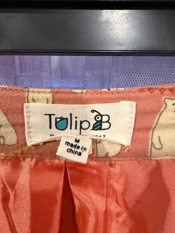 Close-up of polar bears and festive lettering on pink skirt
