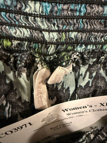 Close-up of skirt waistband, worn interior labels and resale tag marked XL