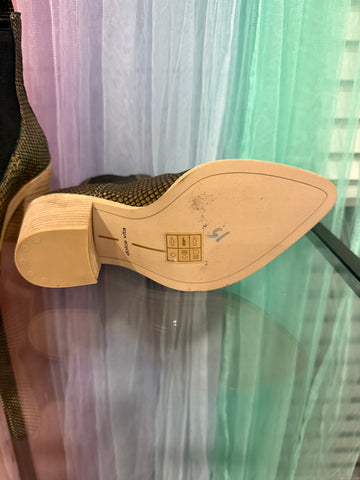 Dolce Vita ankle boot outsole showing brand marking and small marks with sticker residue