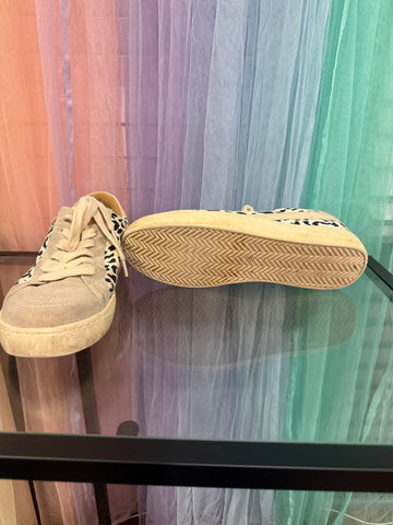 White Haven sneakers showing sole tread and visible wear