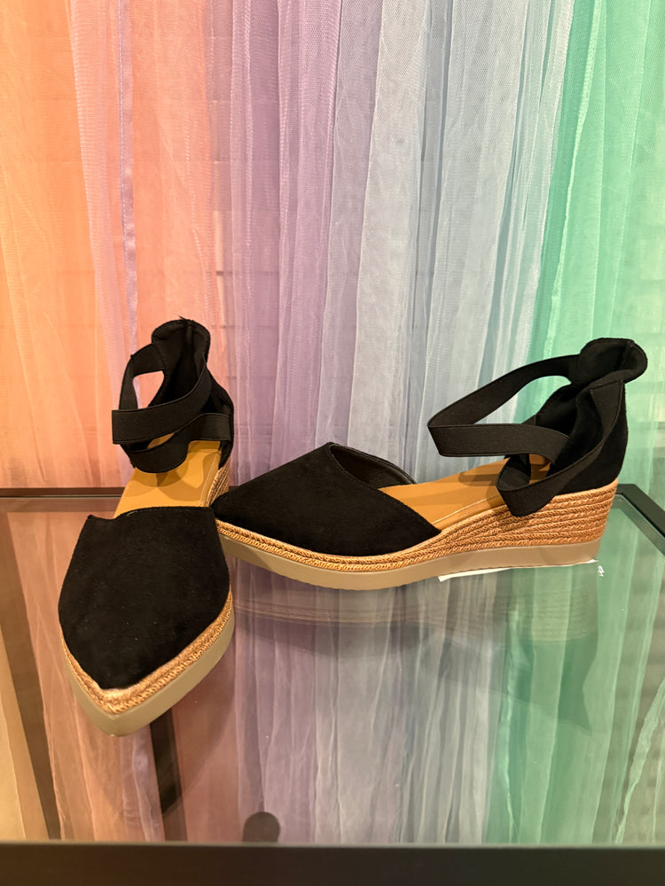 Black closed-toe ankle-strap espadrille wedges, front and side view