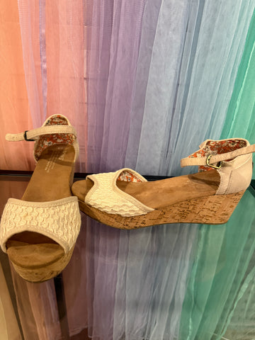 TOMS cream wedge sandals with textured front straps and buckle ankle straps