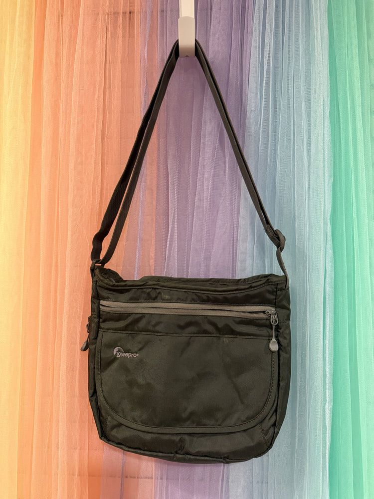 Black Lowepro shoulder bag with adjustable strap and front zip pocket