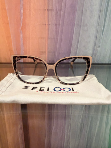 Front view of cream and tortoiseshell-patterned cat-eye prescription eyeglasses