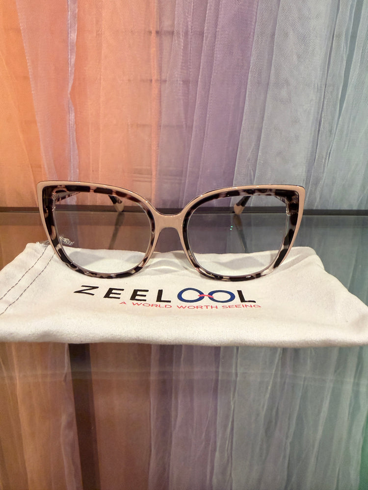 Front view of cream and tortoiseshell-patterned cat-eye prescription eyeglasses