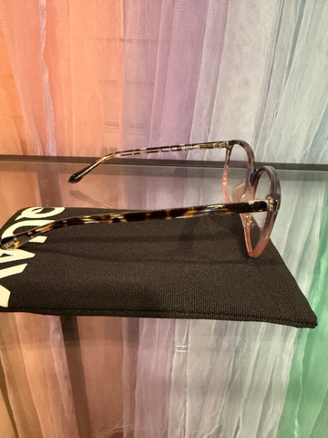 Side view of tortoiseshell-patterned arms and blush eyeglass rims